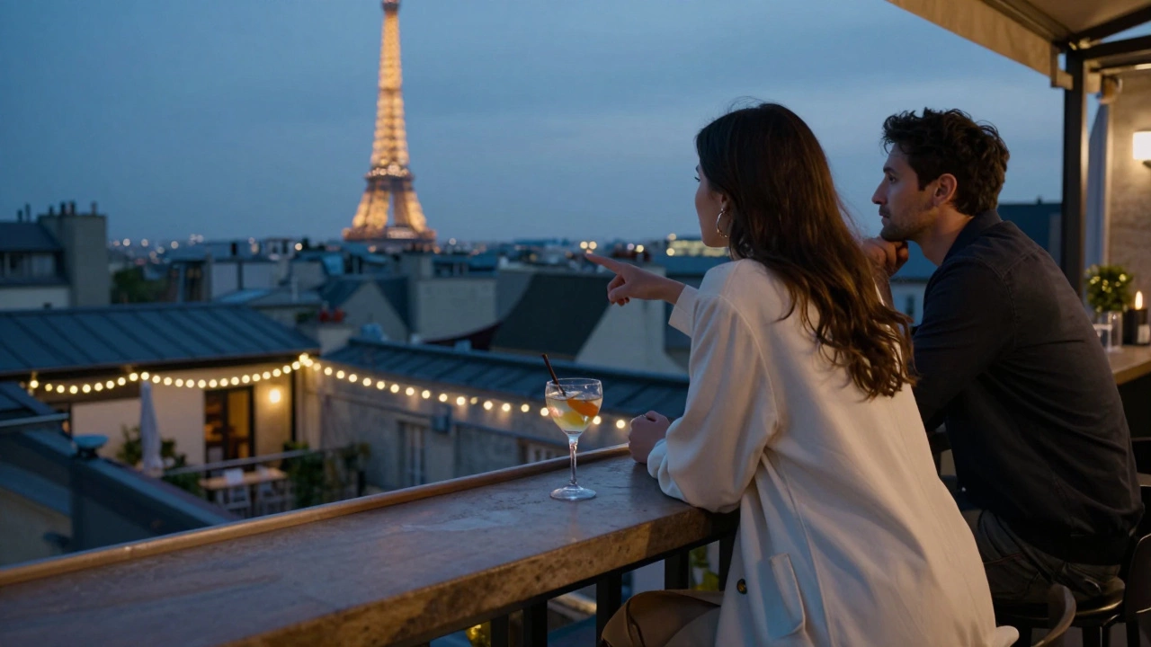 A woman in a cream coat stands on a Paris rooftop at dusk, pointing toward the Eiffel Tower as string lights glow softly behind her.